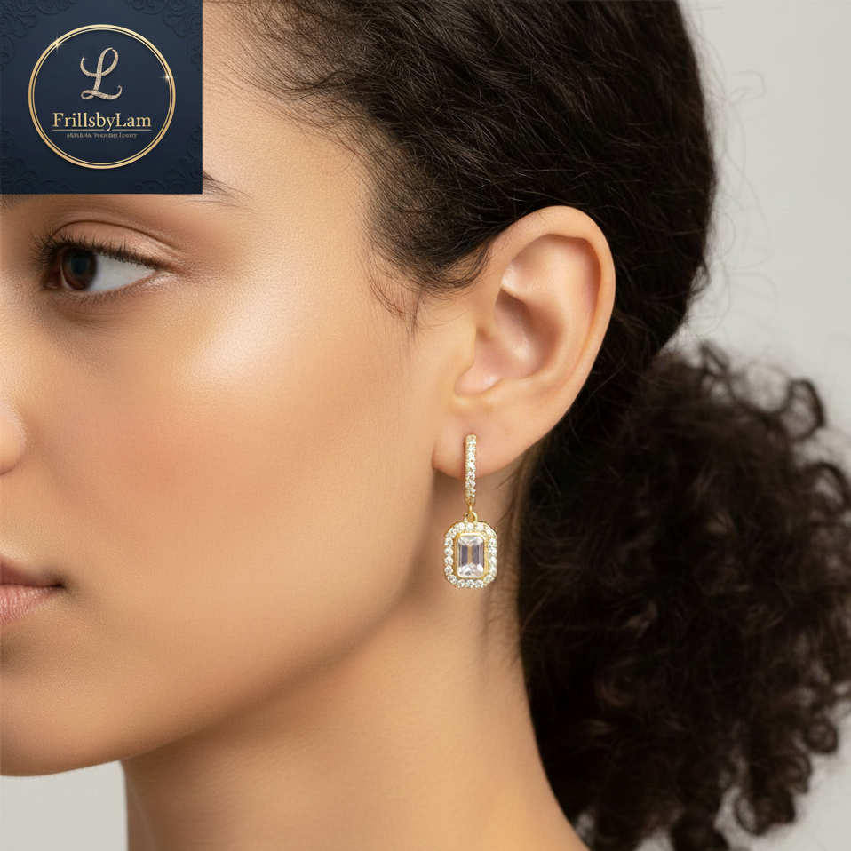 Close-up of a woman wearing a diamond earring with Frillyby Lam logo in the corner.