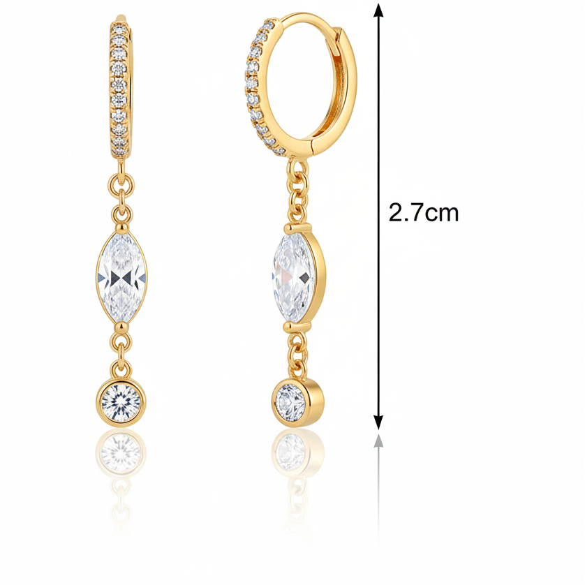 Gold hoop earrings with clear gemstones and FrillsbyLam branding on a white background.