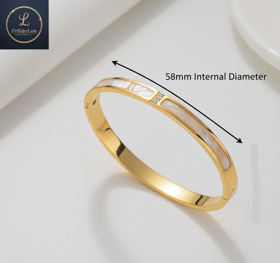 Gold bracelet with measurement details on a white background